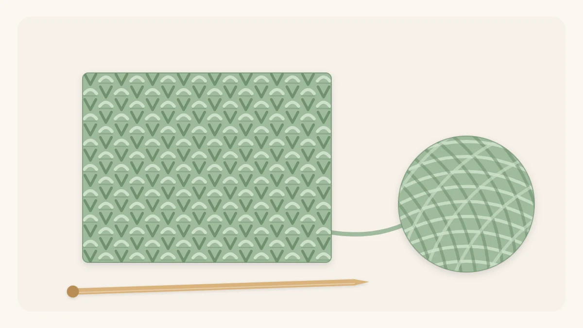 A bumpy seed stitch swatch with a pebbled texture next to a ball of yarn